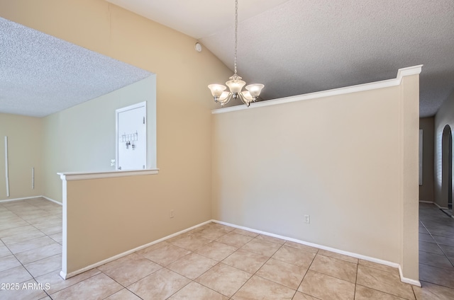 unfurnished dining area featuring a textured ceiling, light tile patterned floors, a chandelier, and vaulted ceiling