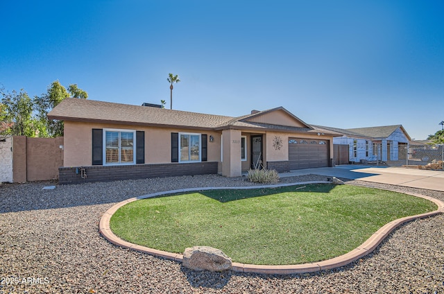 single story home featuring a garage and a front yard