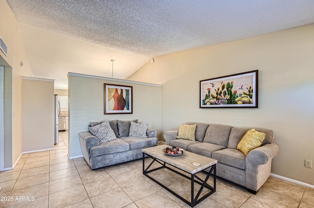 tiled living room with a textured ceiling and vaulted ceiling