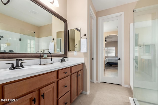 1410 W Popcorn Tree Ave, Queen Creek, AZ 85140 - full bathroom with ensuite bathroom, double vanity, walk in shower, tile patterned floors, and baseboards