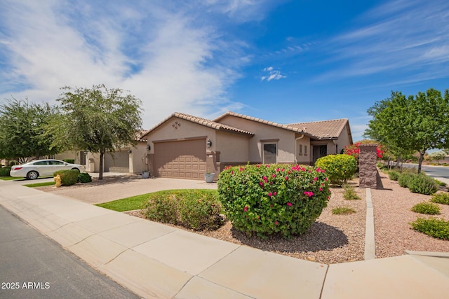 1410 W Popcorn Tree Ave, Queen Creek, AZ 85140 - mediterranean / spanish home featuring an attached garage, driveway, stucco siding, and a tiled roof