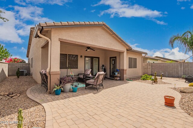 1410 W Popcorn Tree Ave, Queen Creek, AZ 85140 - rear view of house with a ceiling fan, stucco siding, a patio, and cooling unit