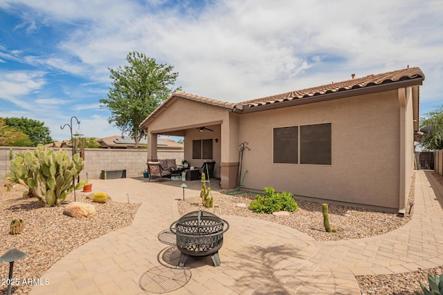 1410 W Popcorn Tree Ave, Queen Creek, AZ 85140 - rear view of house featuring a patio, an outdoor living space with a fire pit, ceiling fan, and a fenced backyard