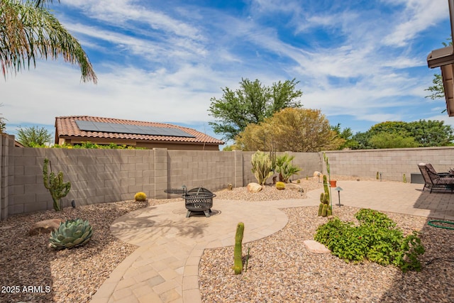 1410 W Popcorn Tree Ave, Queen Creek, AZ 85140 - fenced backyard featuring an outdoor fire pit and a patio