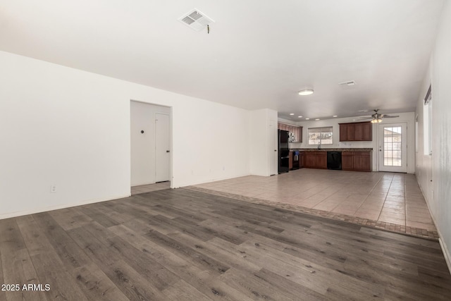 2906 W Irma Ln, Phoenix, AZ 85027 - unfurnished living room with wood finished floors, a ceiling fan, and a sink