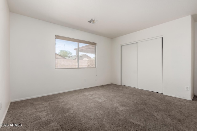 2906 W Irma Ln, Phoenix, AZ 85027 - unfurnished bedroom featuring carpet floors, a closet, and baseboards