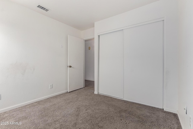 2906 W Irma Ln, Phoenix, AZ 85027 - unfurnished bedroom featuring carpet floors, a closet, and baseboards