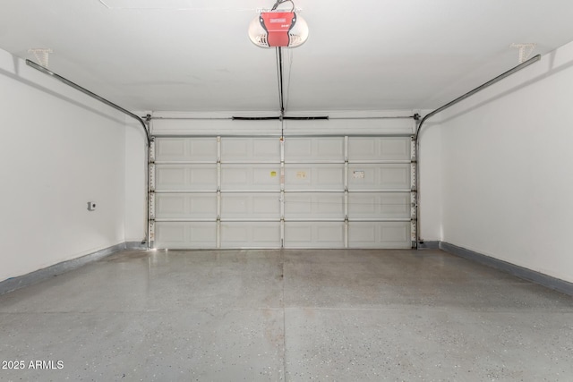 2906 W Irma Ln, Phoenix, AZ 85027 - garage featuring a garage door opener and baseboards