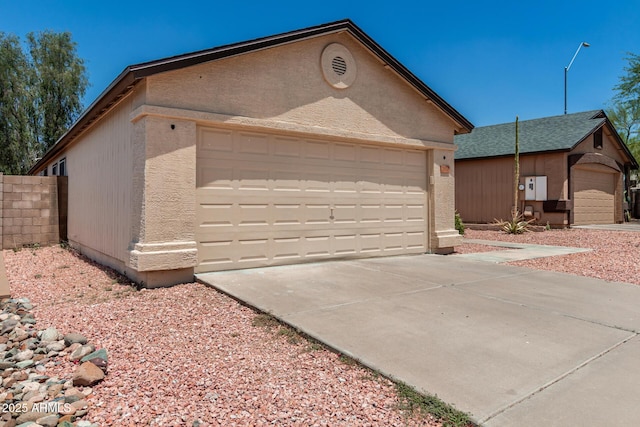 2906 W Irma Ln, Phoenix, AZ 85027 - view of front of property featuring an outdoor structure, concrete driveway, and stucco siding
