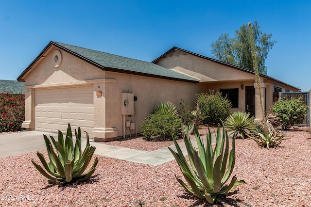 2906 W Irma Ln, Phoenix, AZ 85027 - single story home with an attached garage, stucco siding, driveway, and roof with shingles