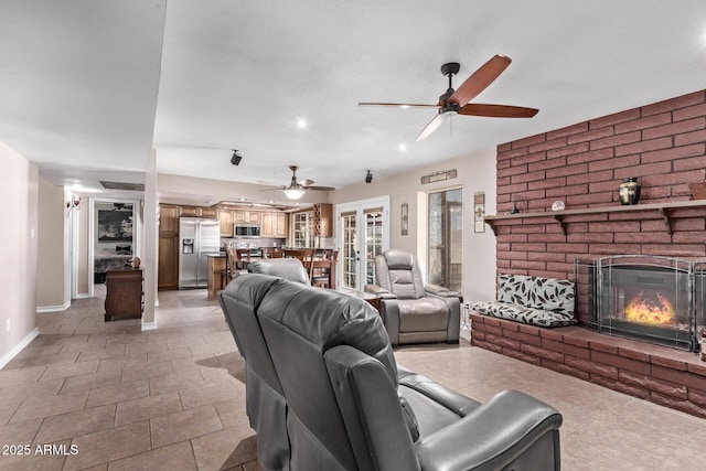 tiled living room with a fireplace and french doors