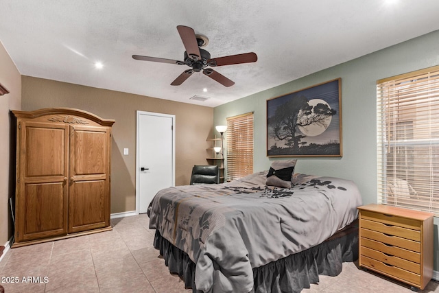 bedroom featuring a textured ceiling and ceiling fan