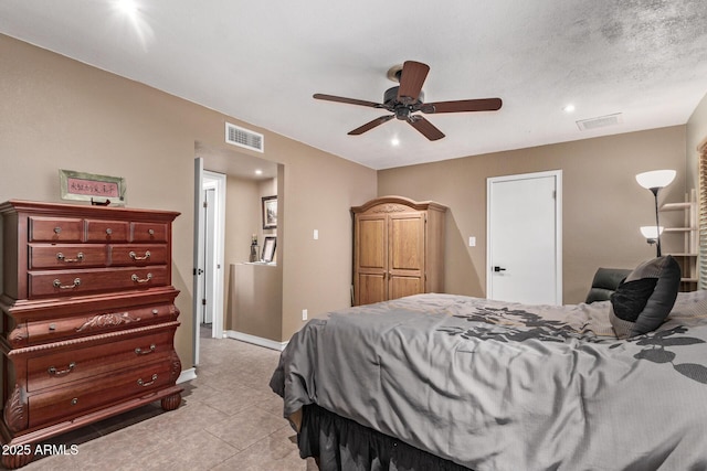 bedroom with ceiling fan and light tile patterned flooring