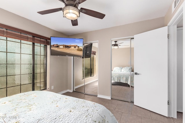 bedroom with light tile patterned floors and ceiling fan