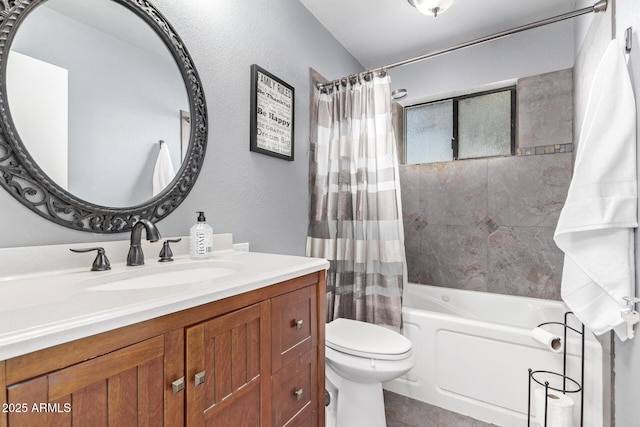 full bathroom featuring vanity, shower / tub combo, and toilet