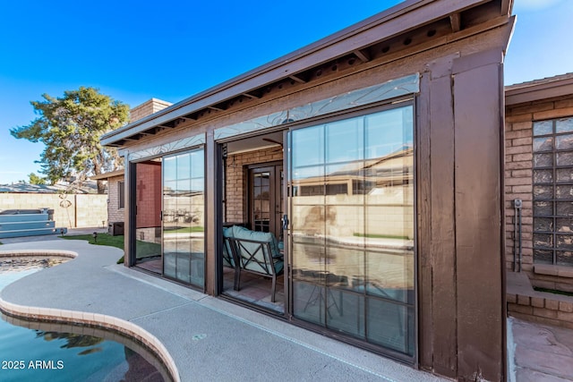 doorway to property with a patio