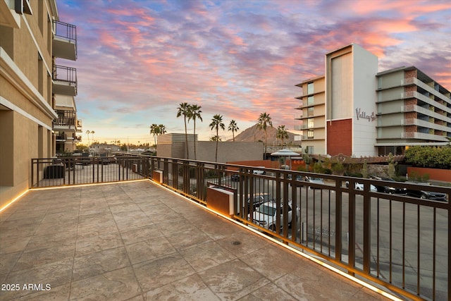 view of balcony at dusk