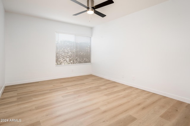 unfurnished room with ceiling fan and light hardwood / wood-style flooring