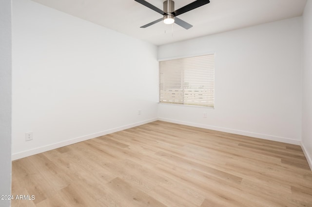 spare room with ceiling fan and light hardwood / wood-style floors