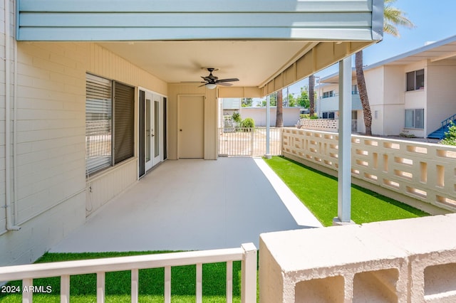 view of patio featuring ceiling fan