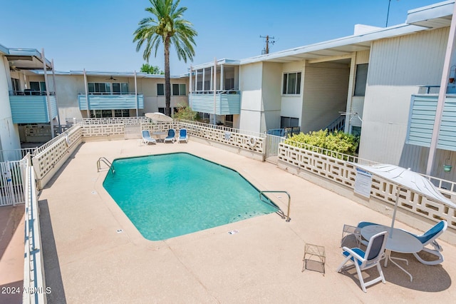 view of swimming pool with a patio area