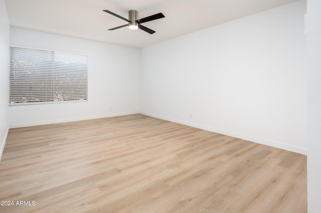 spare room with ceiling fan and light hardwood / wood-style floors