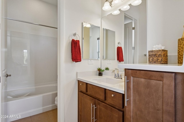 full bathroom featuring tile patterned flooring, vanity, toilet, and tub / shower combination