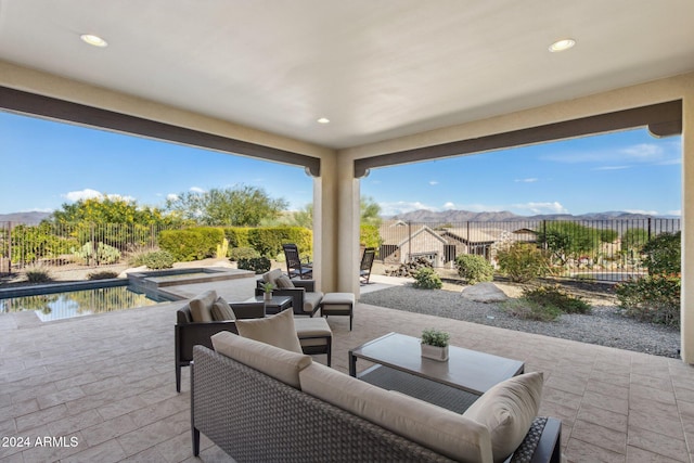 view of patio / terrace featuring a mountain view and an outdoor hangout area