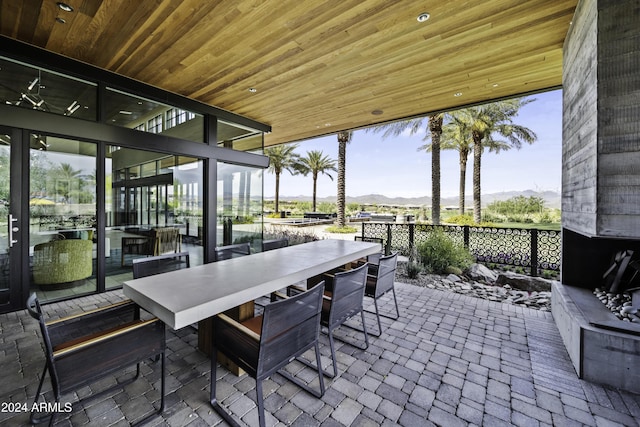 view of patio / terrace with a mountain view and exterior bar