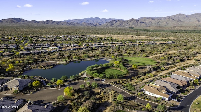 birds eye view of property featuring a water and mountain view