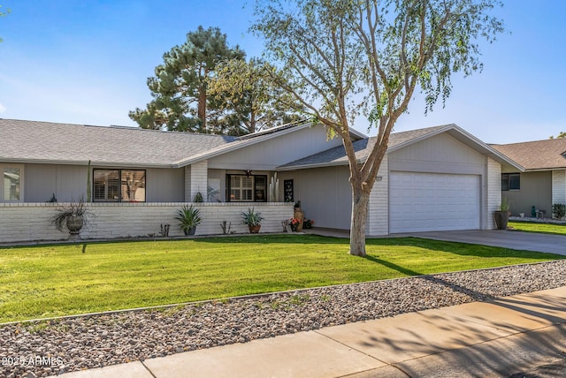 ranch-style house featuring a garage and a front lawn