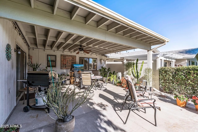 view of patio with ceiling fan and a pergola