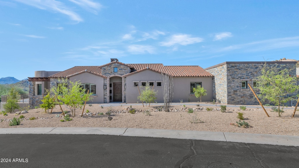 view of front of home featuring a mountain view and a garage