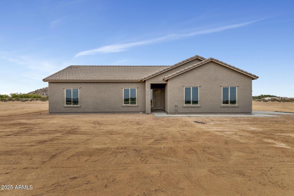 back of house with a patio area