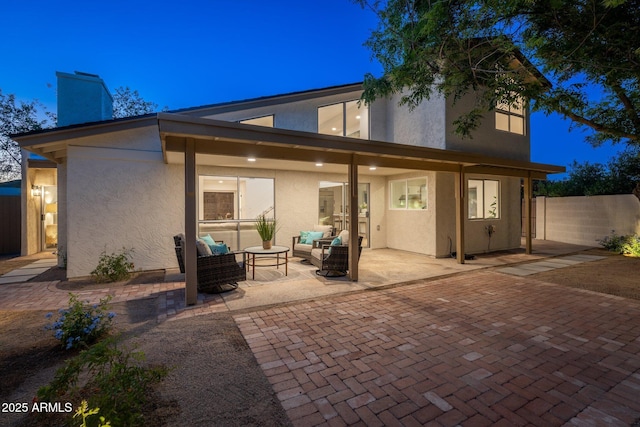 7223 N 14th St, Phoenix, AZ 85020 - back of property featuring an outdoor living space, a patio, a chimney, and stucco siding