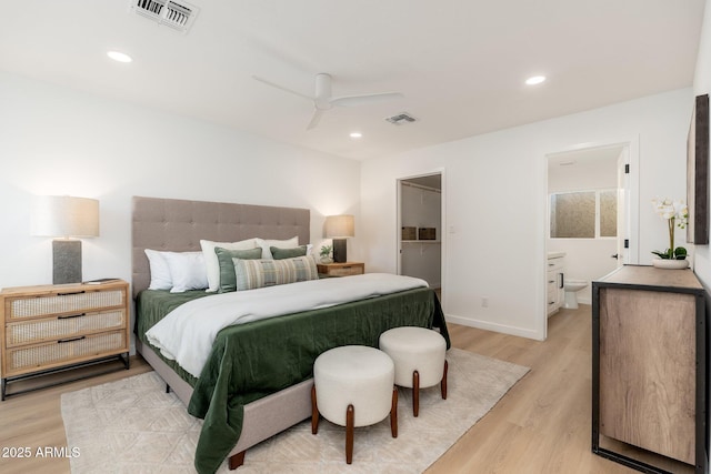 7223 N 14th St, Phoenix, AZ 85020 - bedroom with light wood-type flooring, recessed lighting, ensuite bathroom, baseboards, and a walk in closet