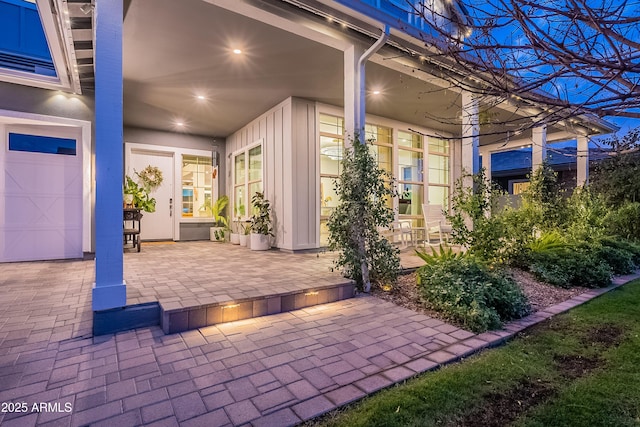 view of patio / terrace featuring a garage