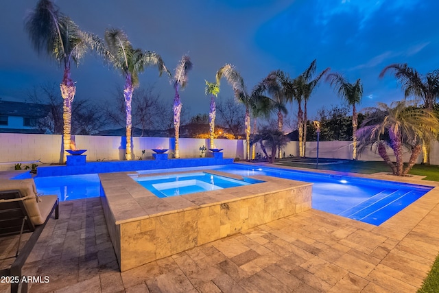 view of pool with an in ground hot tub and a patio area