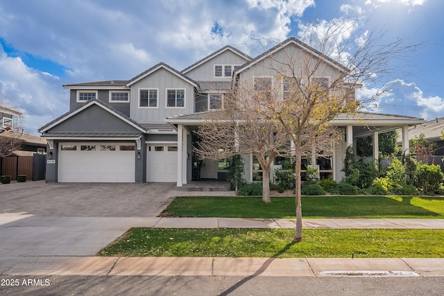 craftsman-style home featuring a garage and a front yard