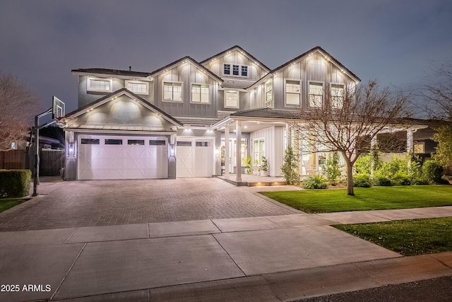 view of front of home featuring a garage and a front yard