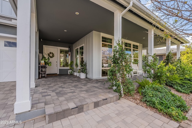 view of exterior entry with a garage