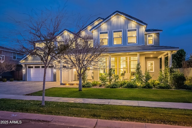 view of front facade featuring a garage and a front lawn