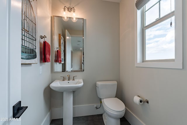 bathroom with sink and toilet