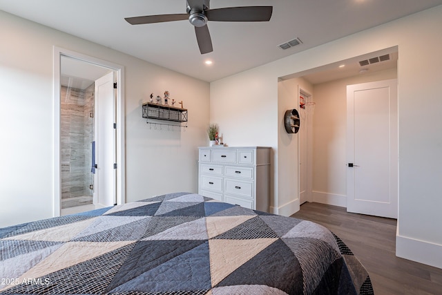 bedroom featuring ceiling fan, connected bathroom, and dark hardwood / wood-style flooring