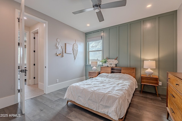 bedroom featuring wood-type flooring and ceiling fan