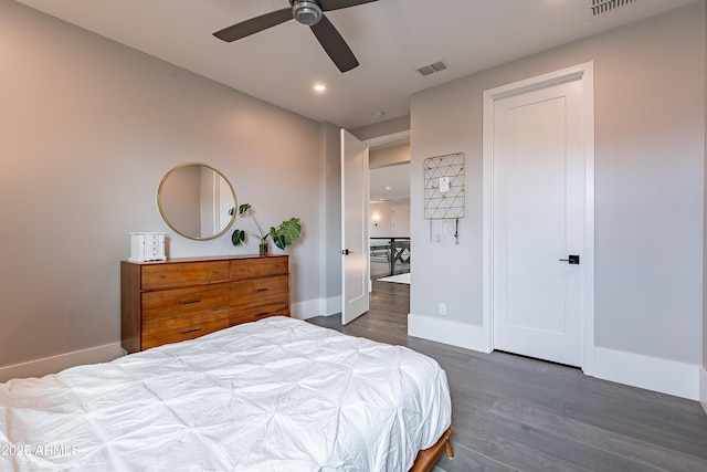 bedroom with dark wood-type flooring and ceiling fan