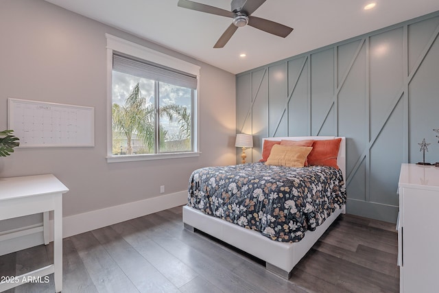 bedroom with dark hardwood / wood-style floors and ceiling fan