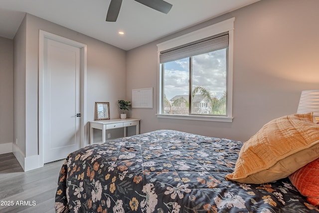 bedroom featuring ceiling fan and light hardwood / wood-style floors