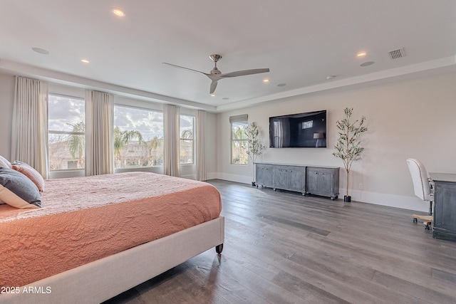 bedroom with wood-type flooring and ceiling fan