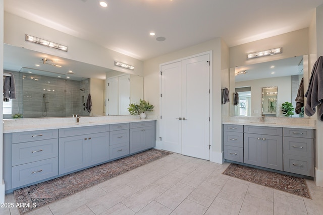 bathroom with walk in shower and vanity